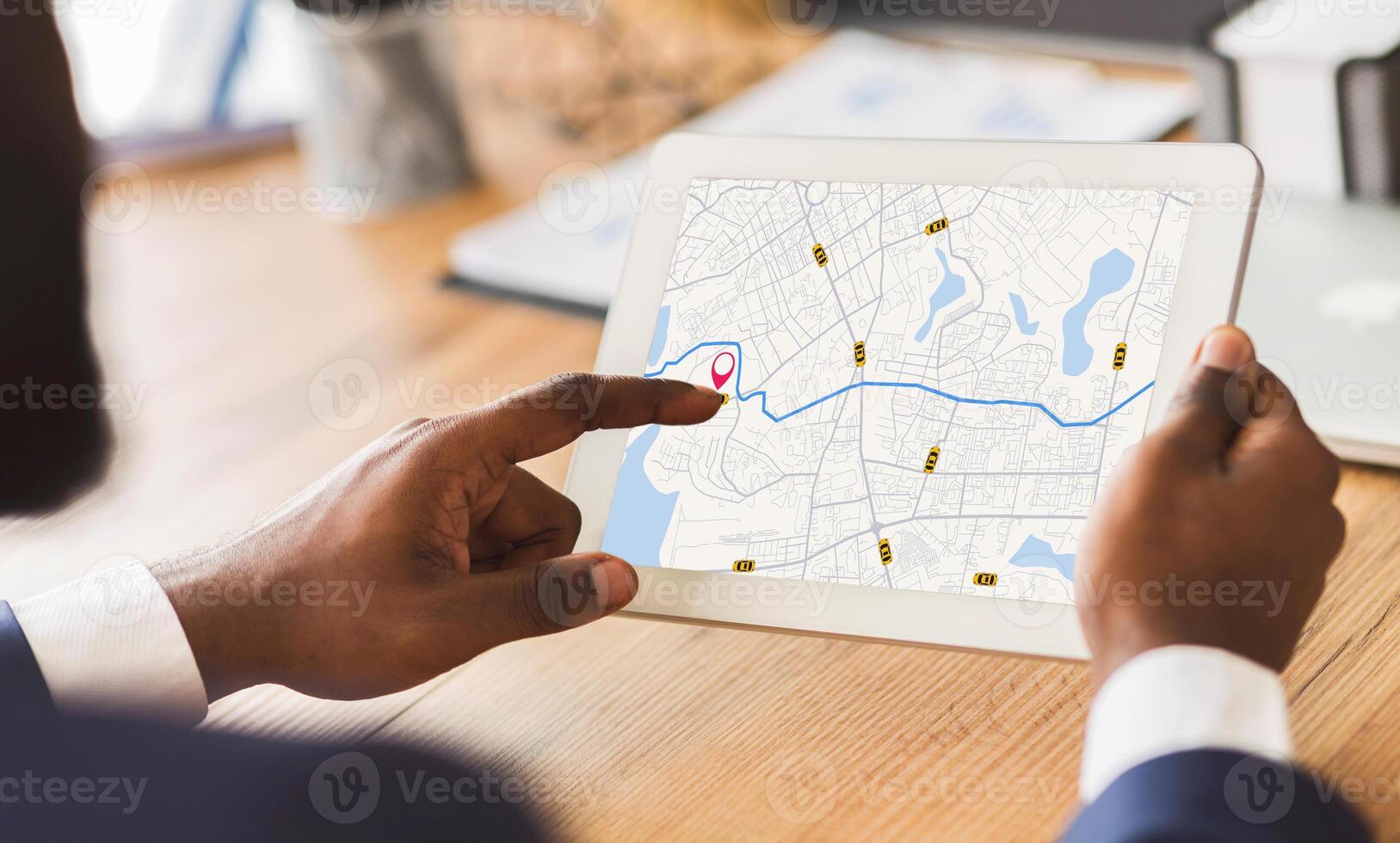 Unrecognizable Black Businessman Using Taxi Services App On Digital Tablet In Office, Looking At Virtual Map With GPS Trackers, Checking Nearest Cab, Creative Collage For Transportration Concept photo
