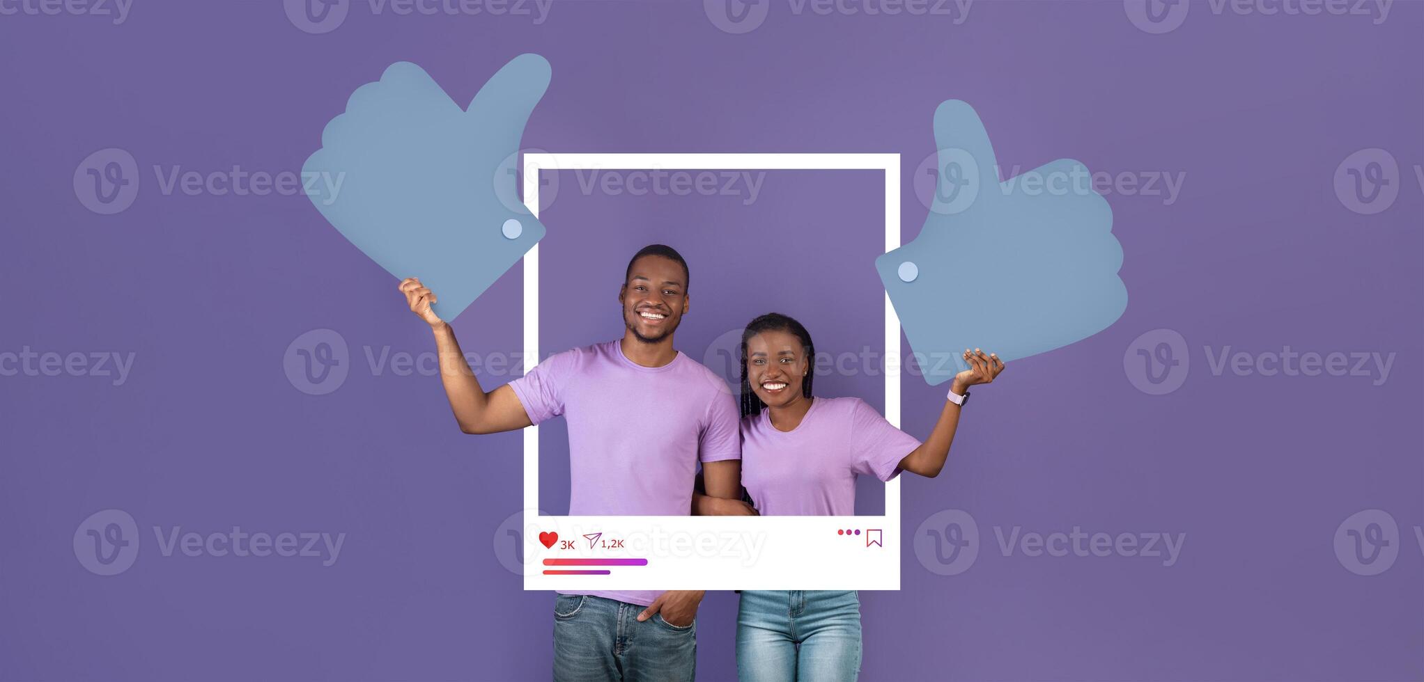 Two cheerful influencers pose with oversized thumbs up signs against a purple background, celebrating their success in creating engaging online content for their followers. photo