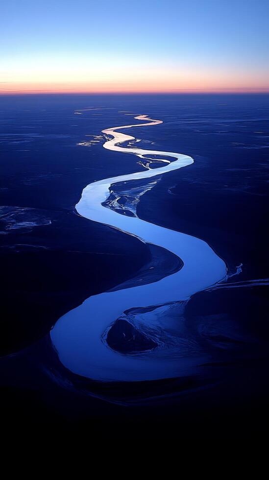 Serene Winding River at Dawn. A Breathtaking Aerial Perspective of a Majestic River Meandering Through a Picturesque Landscape. A Stunning Natural Scenery Captured at Sunrise or Sunset. photo