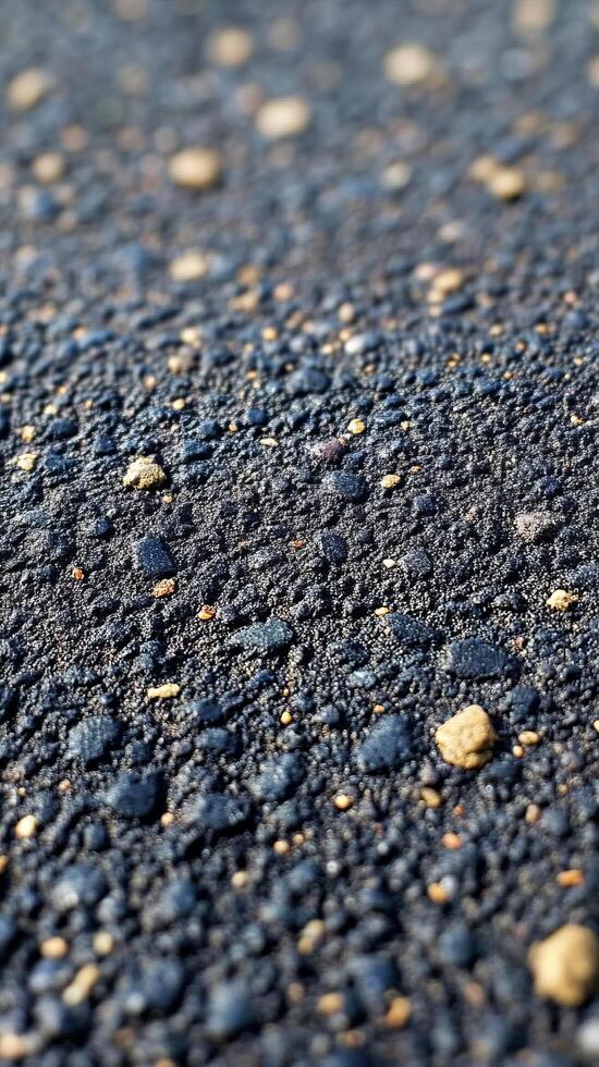 A captivating revealing the intricate texture of dark stones, pebbles, and gravel. The image showcases a detailed view of the nat photo