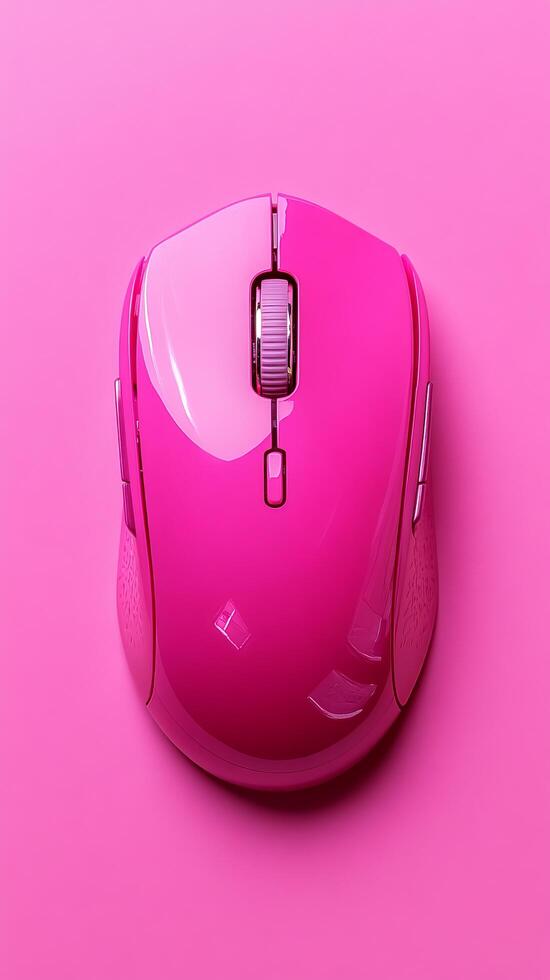 A vibrant pink wireless computer mouse, a stylish and ergonomic input device for modern digital workspaces. This compact and porta photo