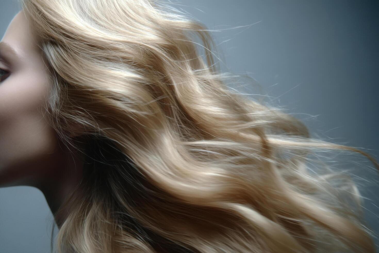 Flowing Blonde Hair A Study in Beauty and Elegance. This image captures the exquisite texture and movement of long, blonde hair, photo