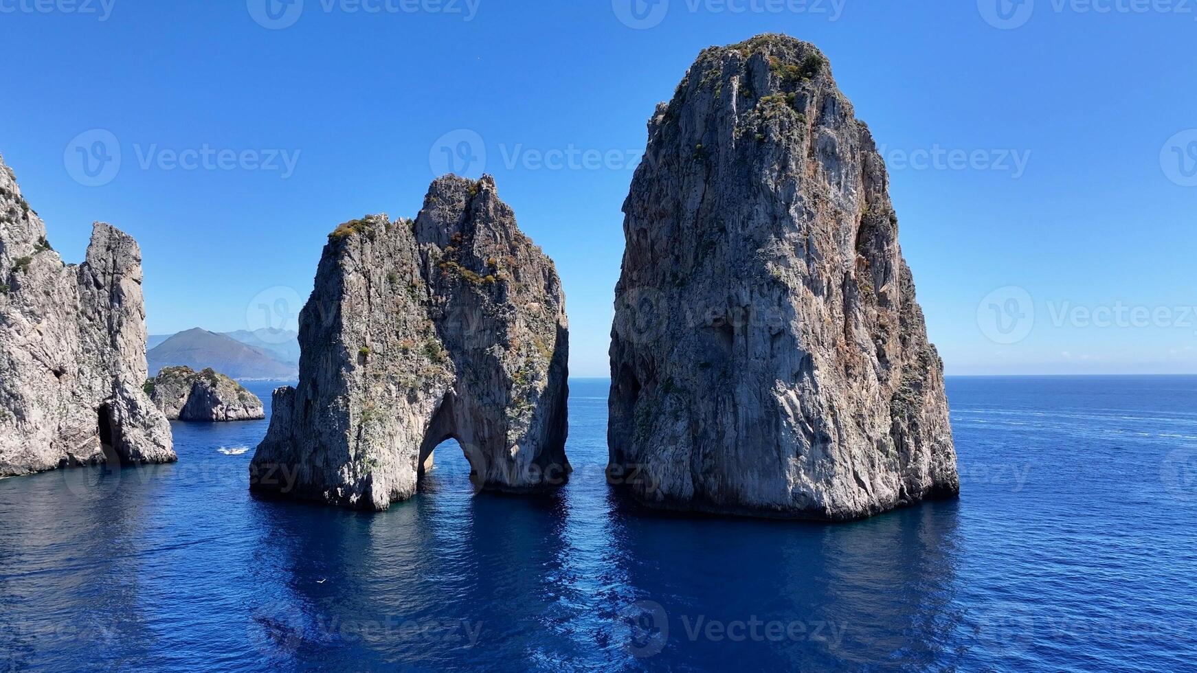 Famous Faraglioni of Capri at Naples Campania in Italy. Beauty Cinematic. photo