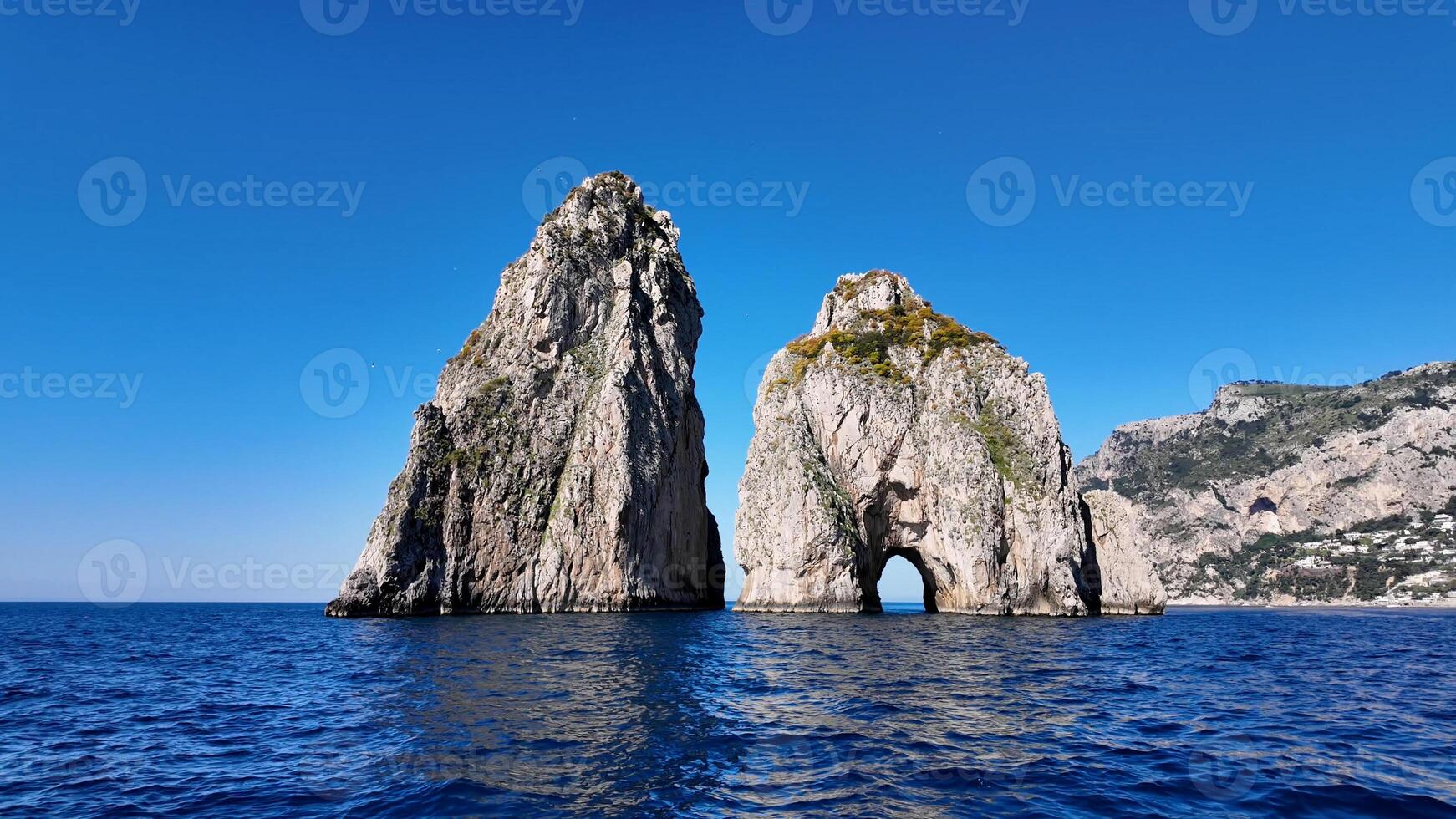 Incredible Faraglioni in Capri Naples in Italy . Famous Cinematic. photo