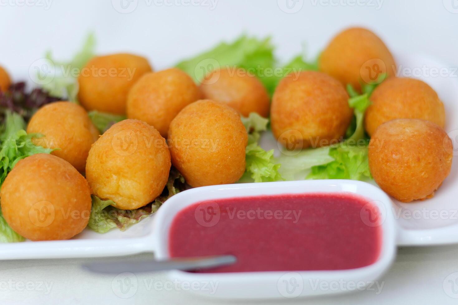 Fried cheese balls with sauce Fast food cheese balls breaded with salt and spices photo