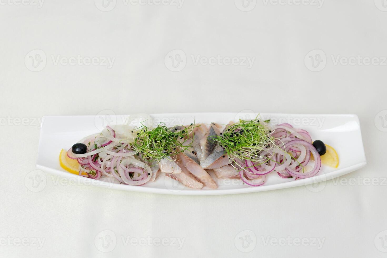 herring Set with delicious salted herring fillets on white background, top view photo