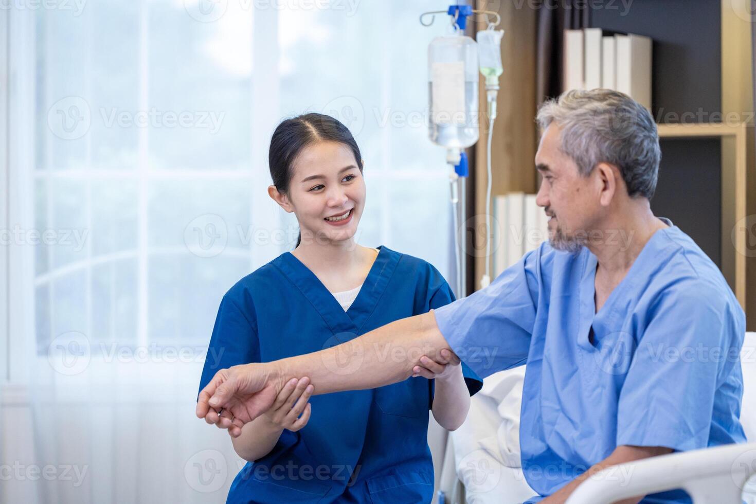 Asian seniorman patient get medical service visit from caregiver nurse at hospital while doing physical therapy to shoulder stretching for muscle pain in health care and pension welfare photo