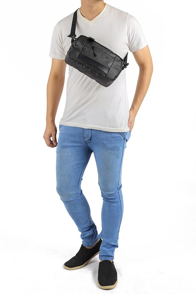 Young man wearing a sling bag photo