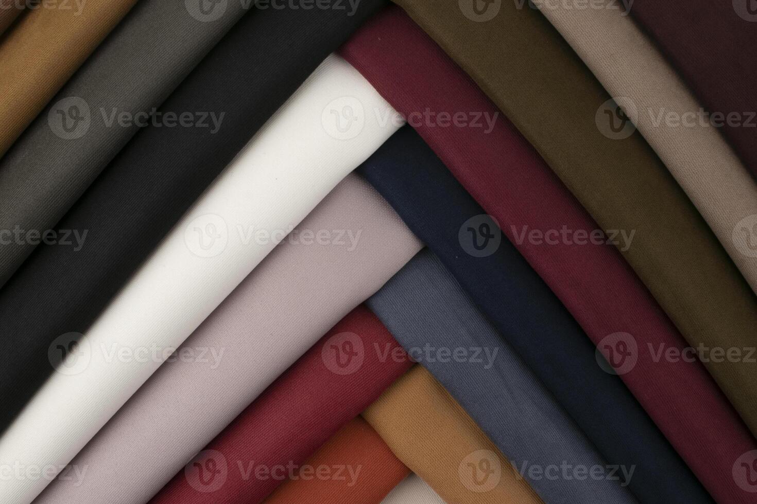 background of stack fabric different colored cloths photo