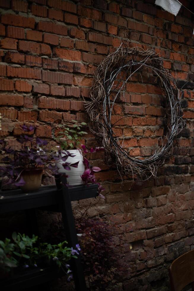 A wreath on a brick wall photo