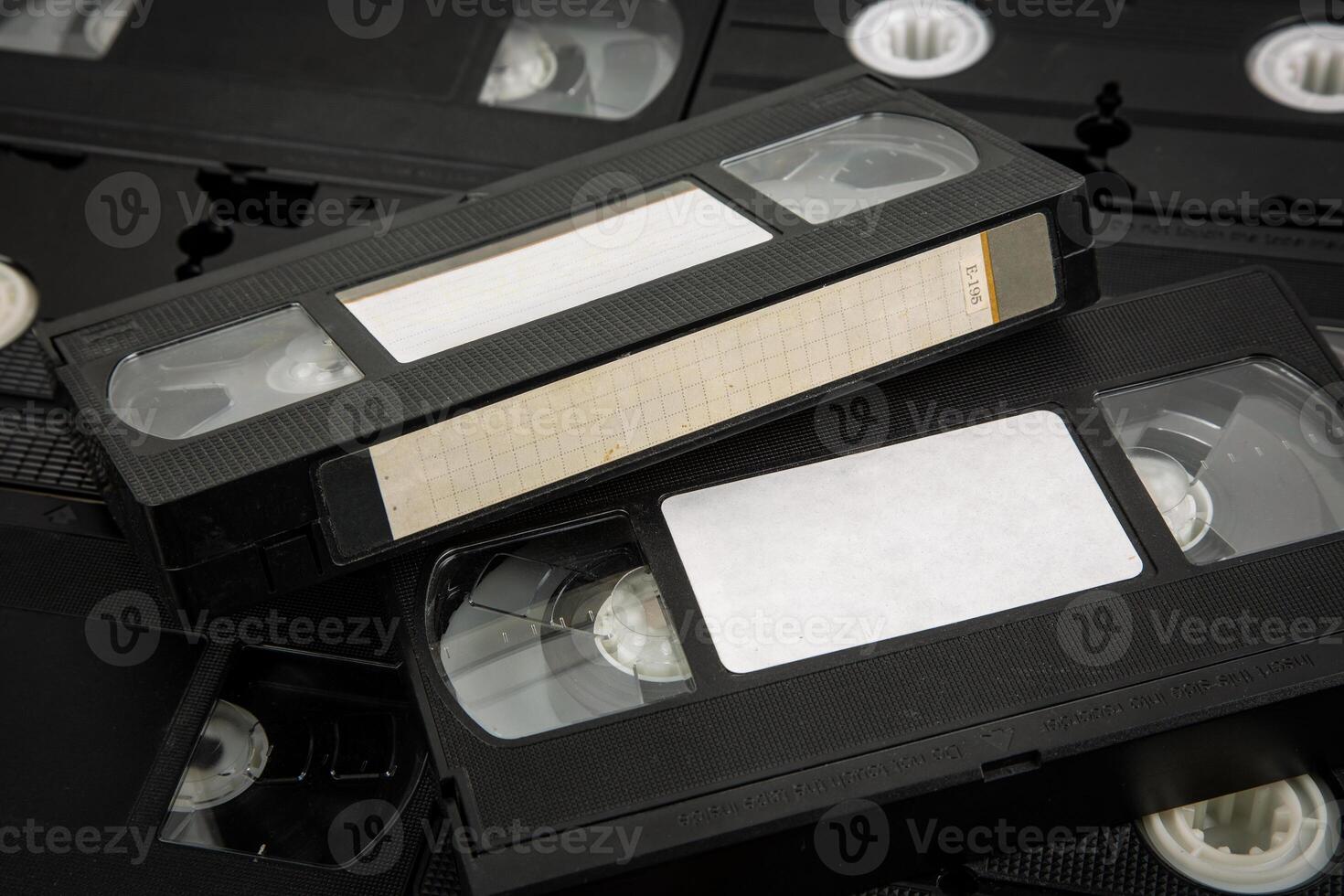 Close-up view of retro VHS cassettes with blank labels photo