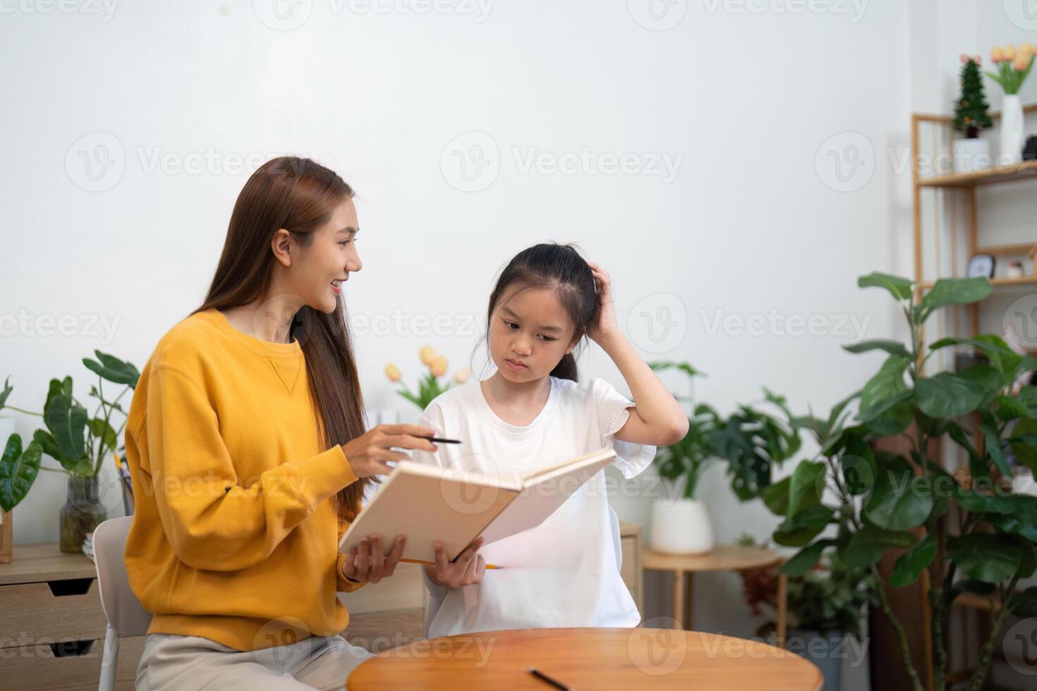 Back to school discussion with mother and daughter reviewing notes photo