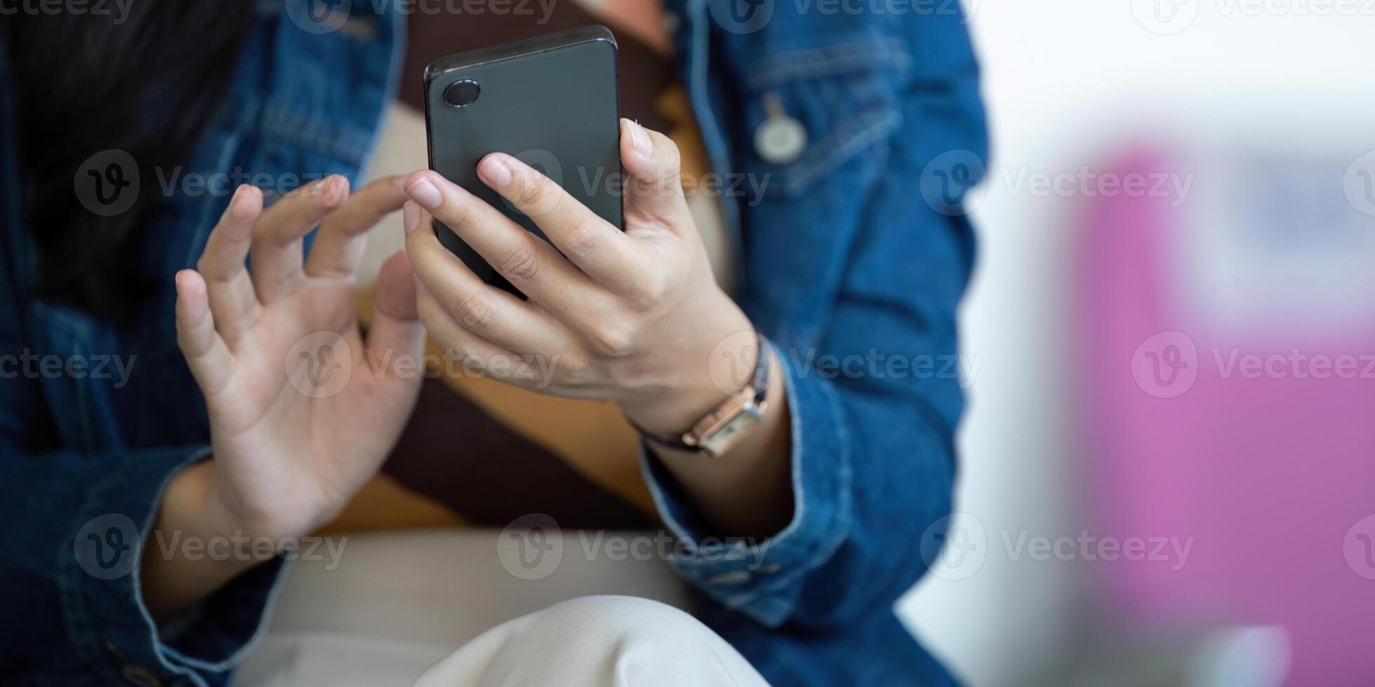 Journey focus with traveler using smartphone in airport seating area photo