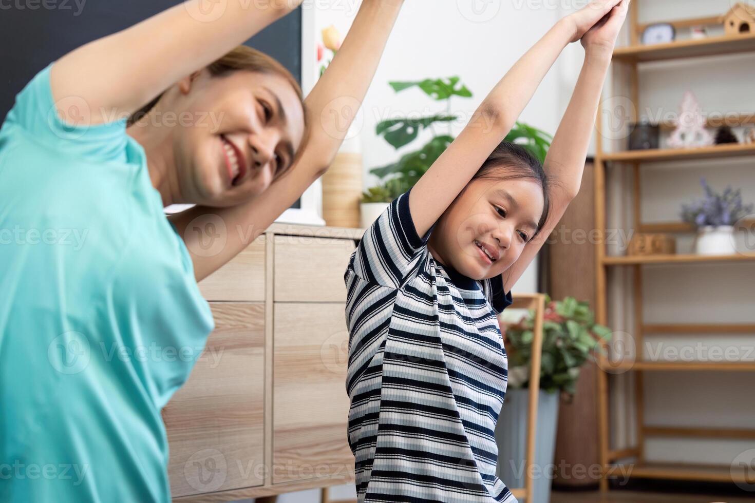 Wellness connection of mother and daughter stretching during yoga photo
