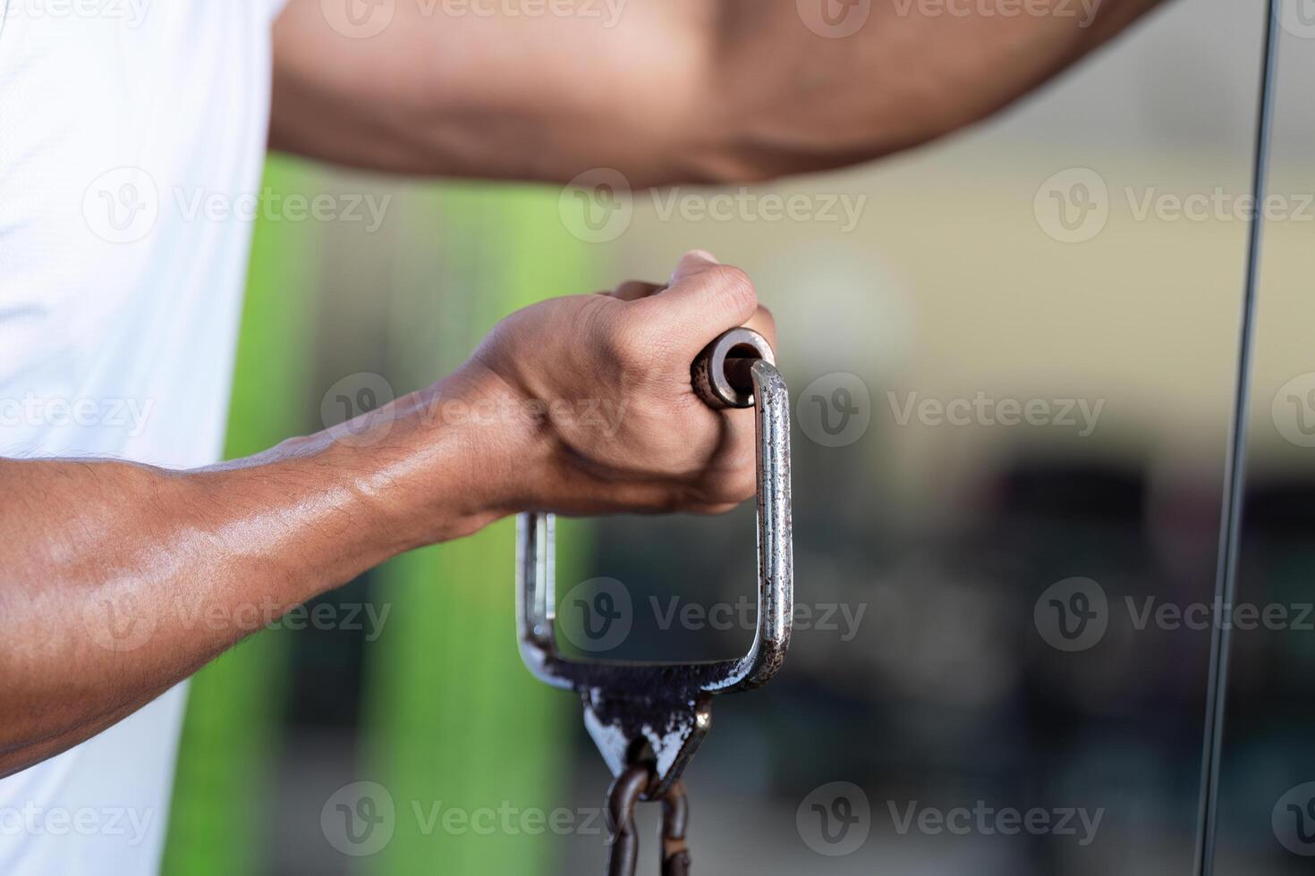 Wellness and Fitness. Close-up of a strong hand gripping gym equipment during a workout session. photo