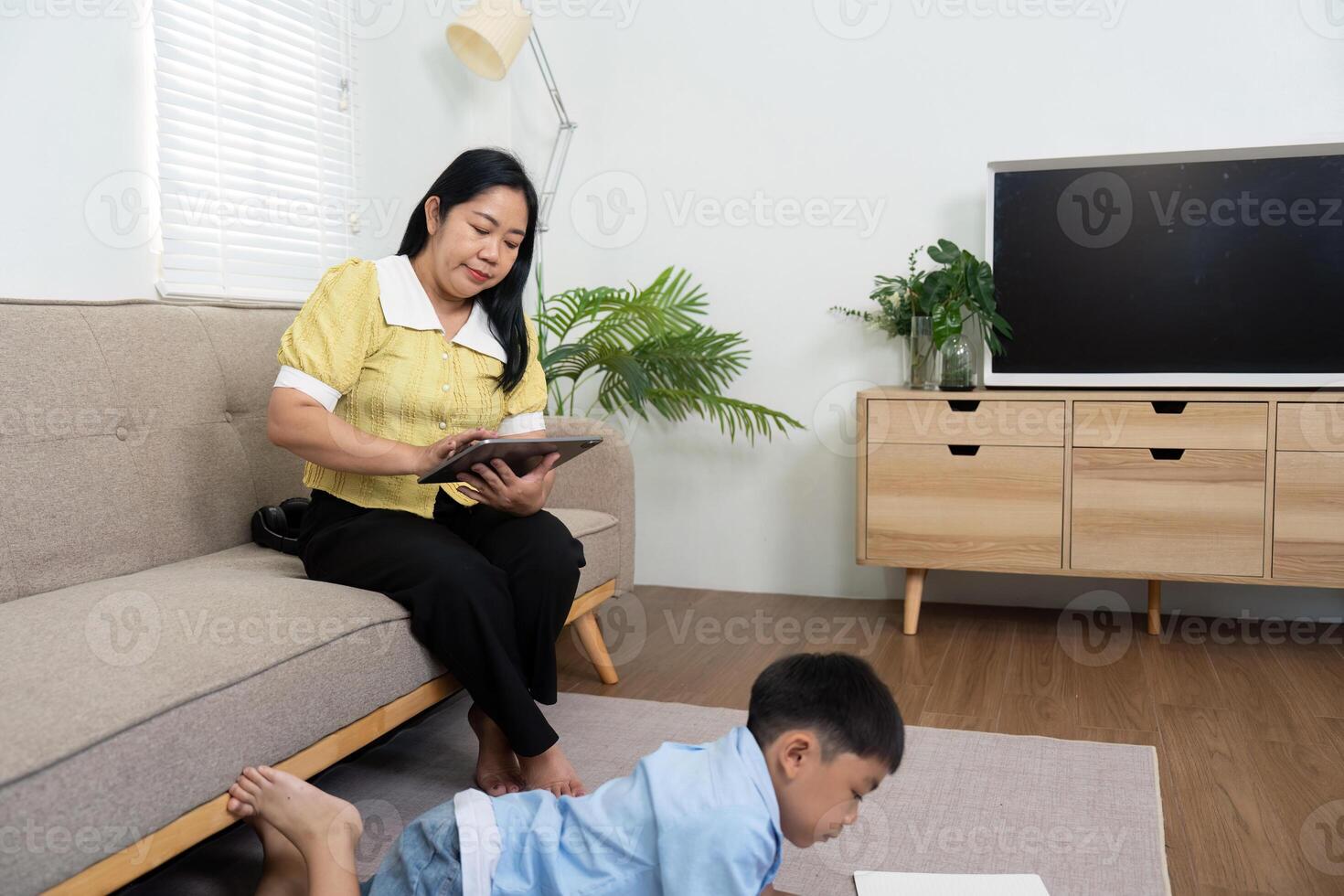 Back to School. Mother Assisting Son with Homework photo