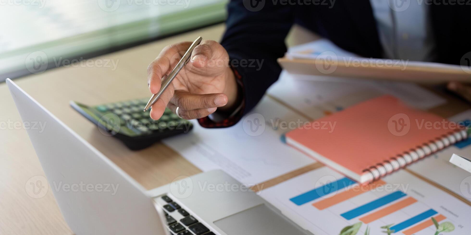 Business Collaboration and Financial Planning. A professional discussing strategies with a calculator. photo