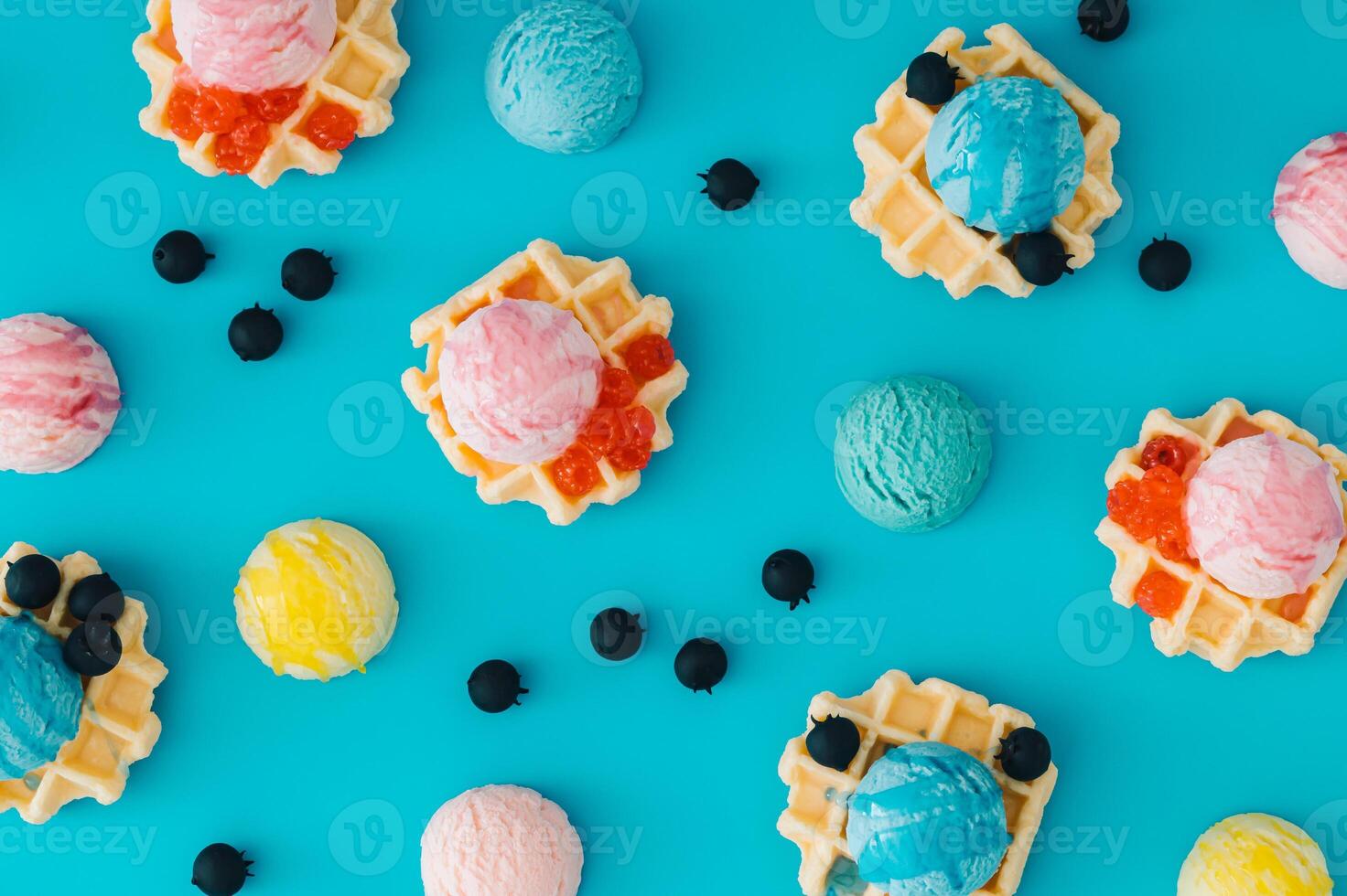 Colorful pattern with waffles, ice cream scoops, raspberries and fresh blueberries on pastel blue background. Sweet food concept. Perfect for summer themed designs and playful backdrops. Flat lay. photo