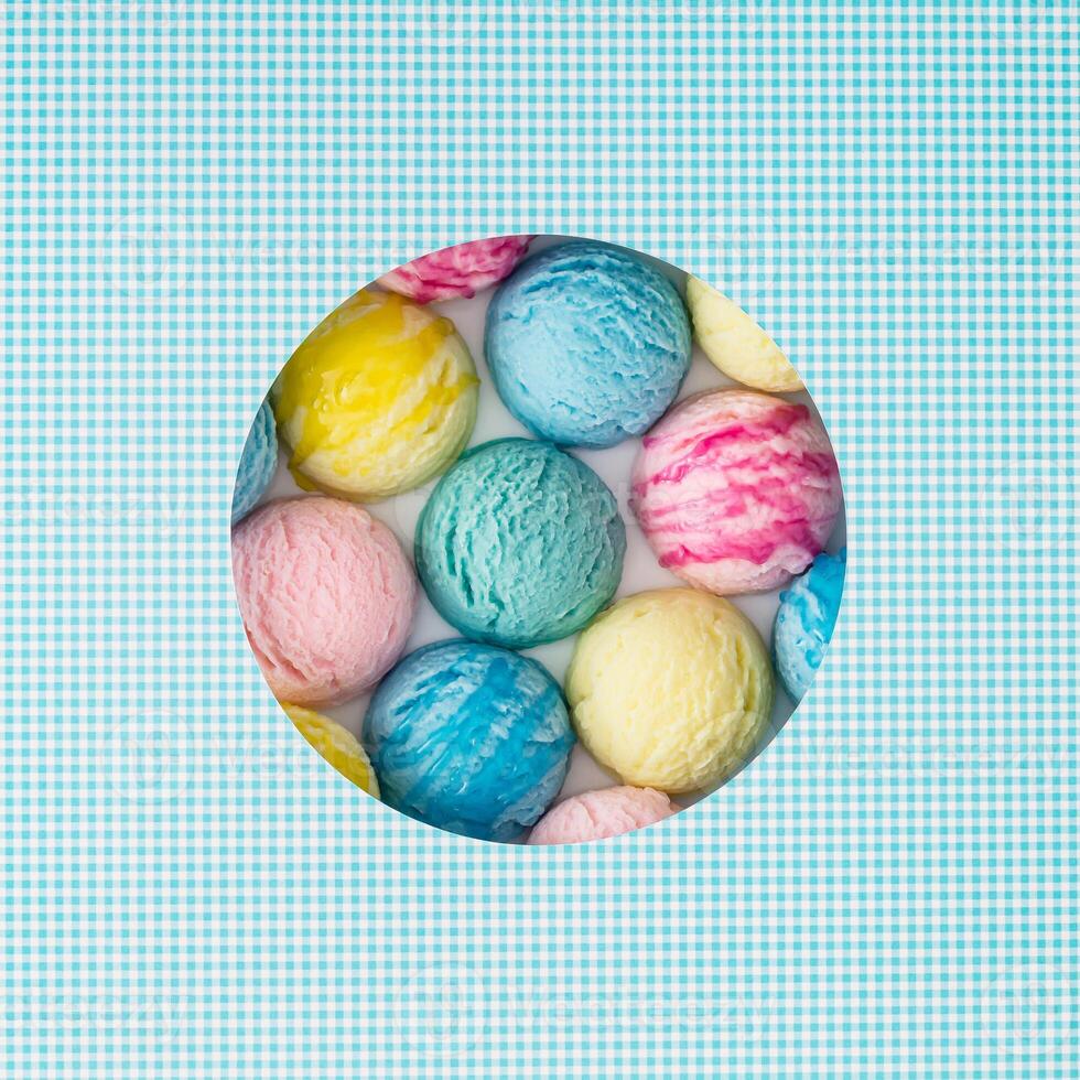 Creative summer composition with colorful ice cream scoops visible through a circle shaped gap on white and blue background. Sweet food concept. Trendy yummy dessert idea. Flat lay style. Top view. photo