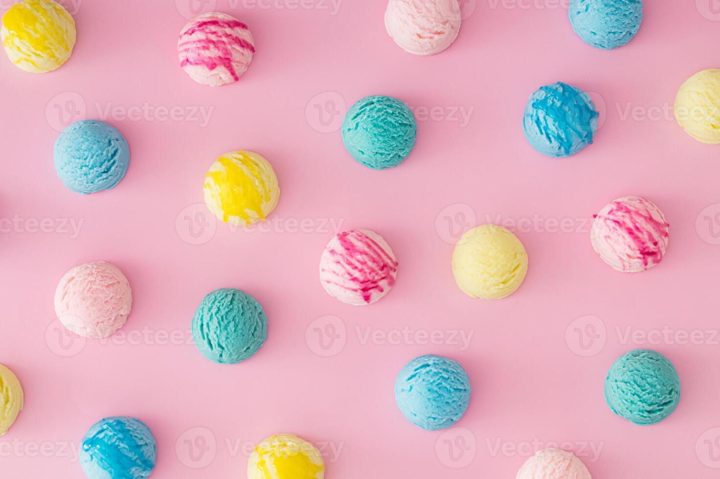 Colorful pattern composition made of various ice cream scoops on pastel pink background. Minimal summer concept. Trendy sweet dessert idea background. Ice cream aesthetic backdrop. Flat lay style. photo