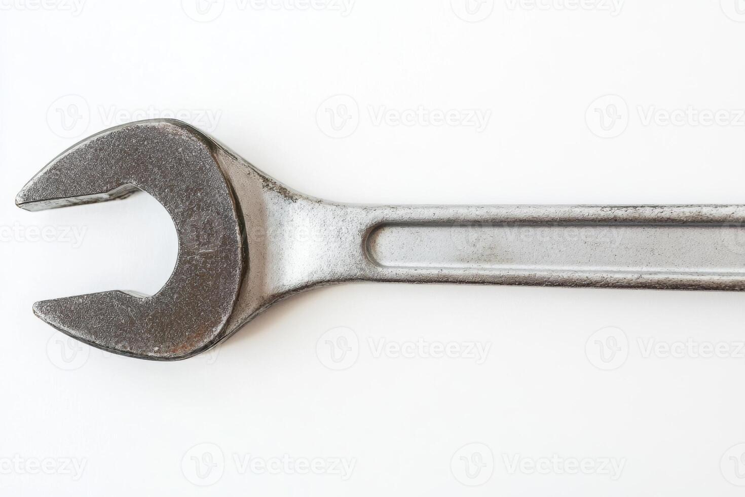 Top view of a ratcheting wrench isolated on white background highlighting its essential role in mechanical tasks photo