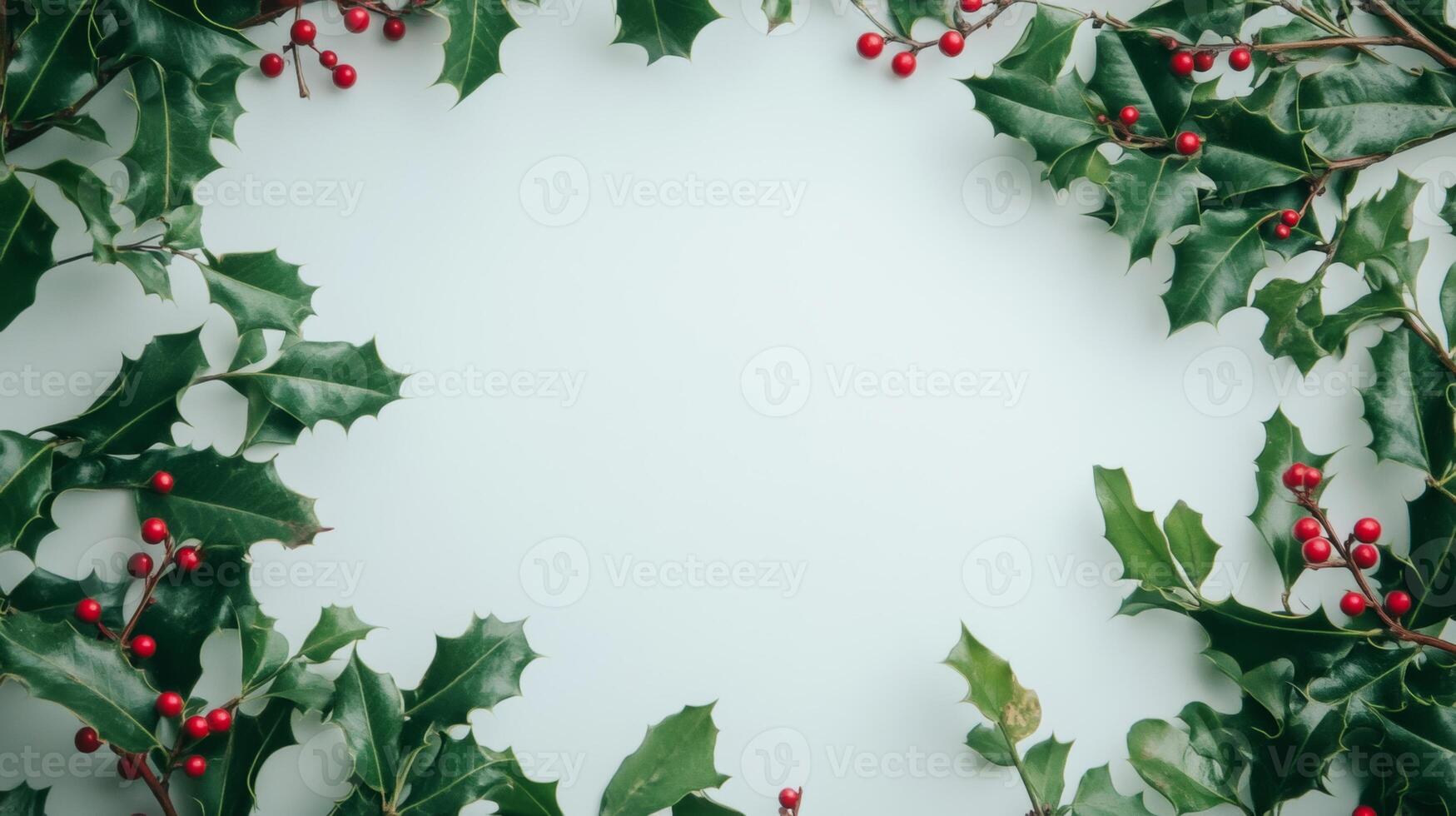 Festive holly leaves and vibrant red berries arranged on a bright white background, perfect for holiday decorations and celebrations photo