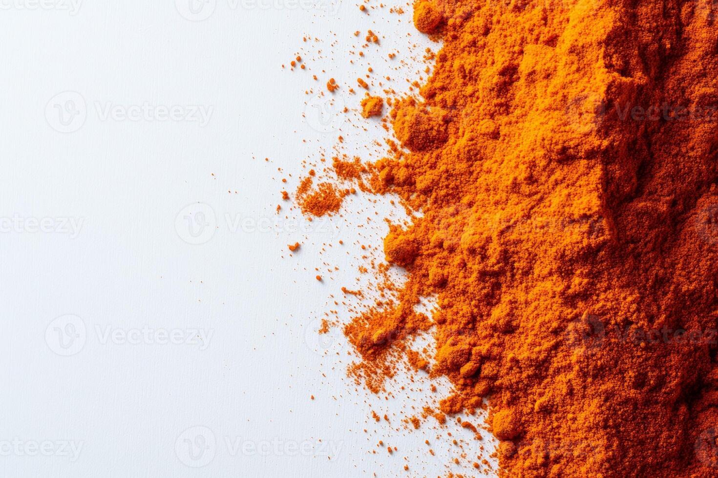 Vibrant paprika powder scattered on a clean white background, highlighting its rich color and fine texture, perfect for culinary use and spice blends photo