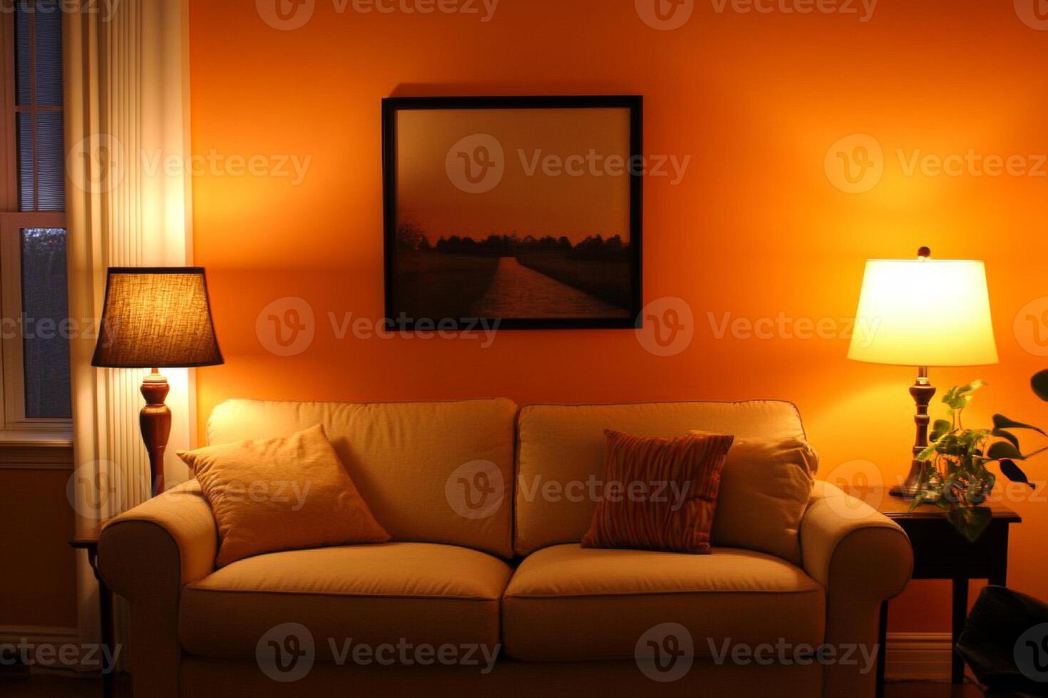 A cozy living room featuring warm orange walls and a stylish sofa, perfect for relaxation and comfort during the evening photo