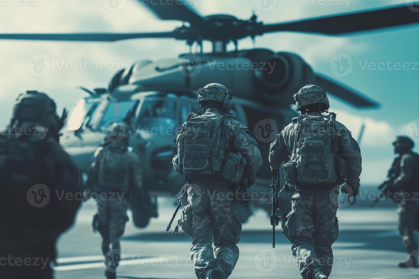 Military personnel disembarking from a helicopter during a deployment operation on a clear day photo