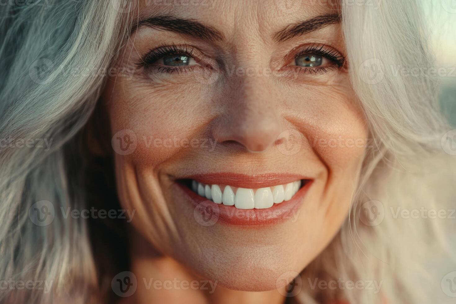 Older woman's radiant smile after dental whitening procedure highlights healthy teeth and satisfaction from dental care photo
