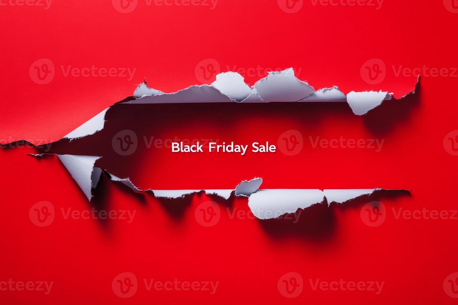 Exciting Black Friday sale announcement with a torn paper effect on a bold red background, perfect for holiday shopping promotions photo