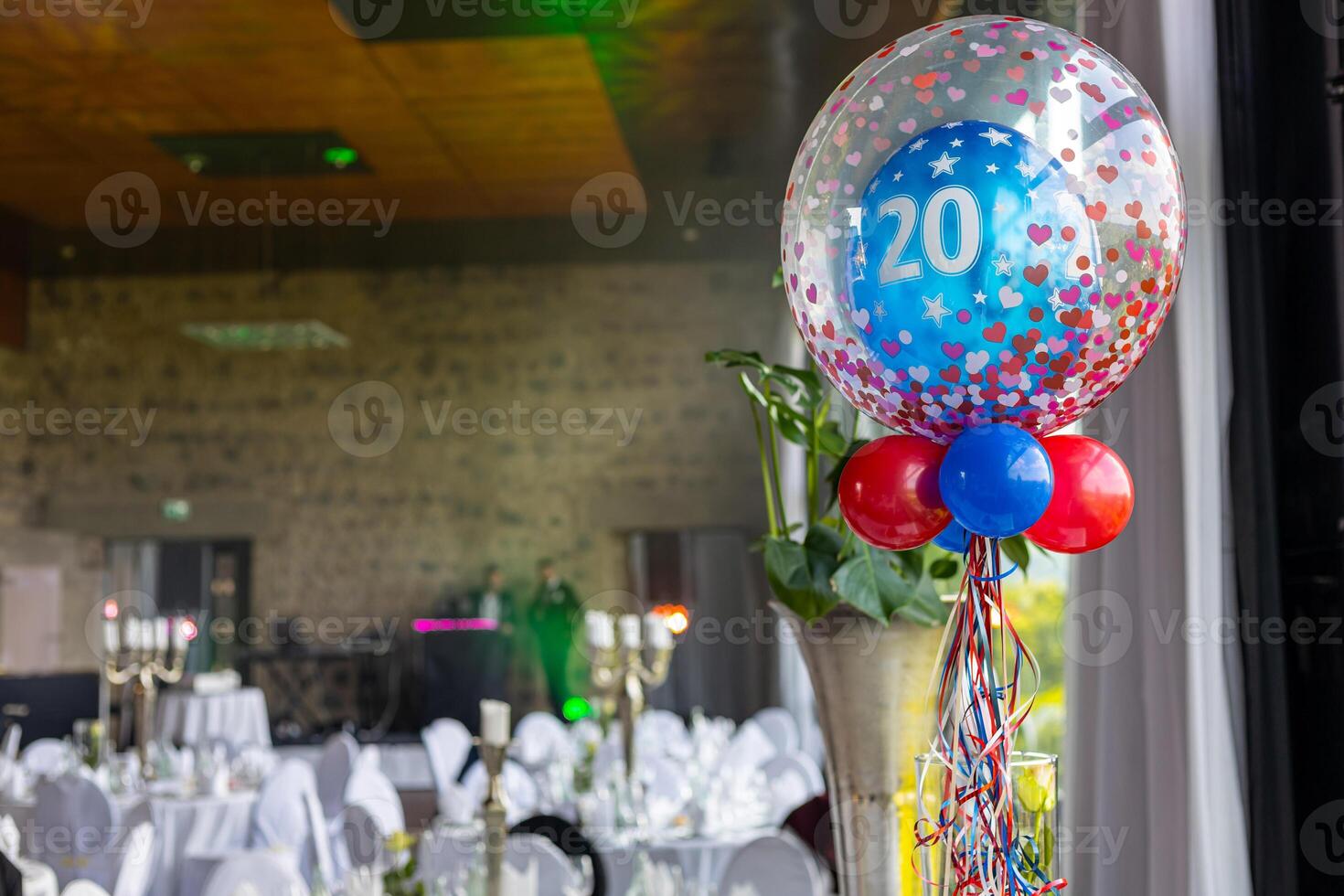 Celebration of a milestone birthday with decorations and a festive atmosphere in an elegant venue photo