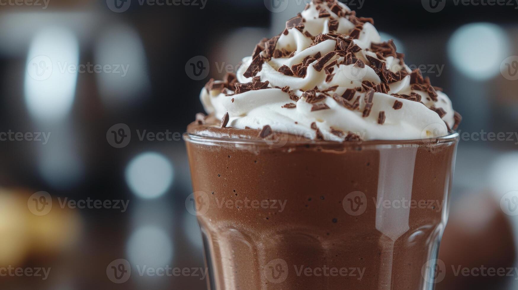 Creamy chocolate milkshake topped with whipped cream and chocolate sprinkles in a glass, delicious dessert drink for chocolate lovers, indulgent treat concept photo