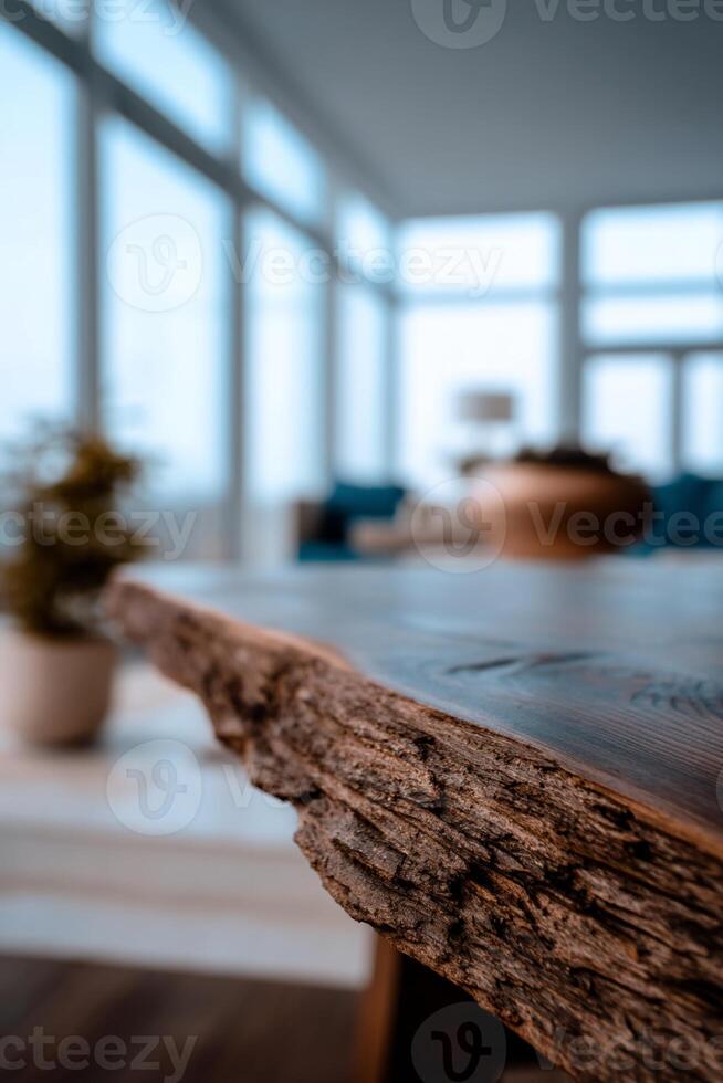 Rustic wooden table edge, overlooking a bright room photo