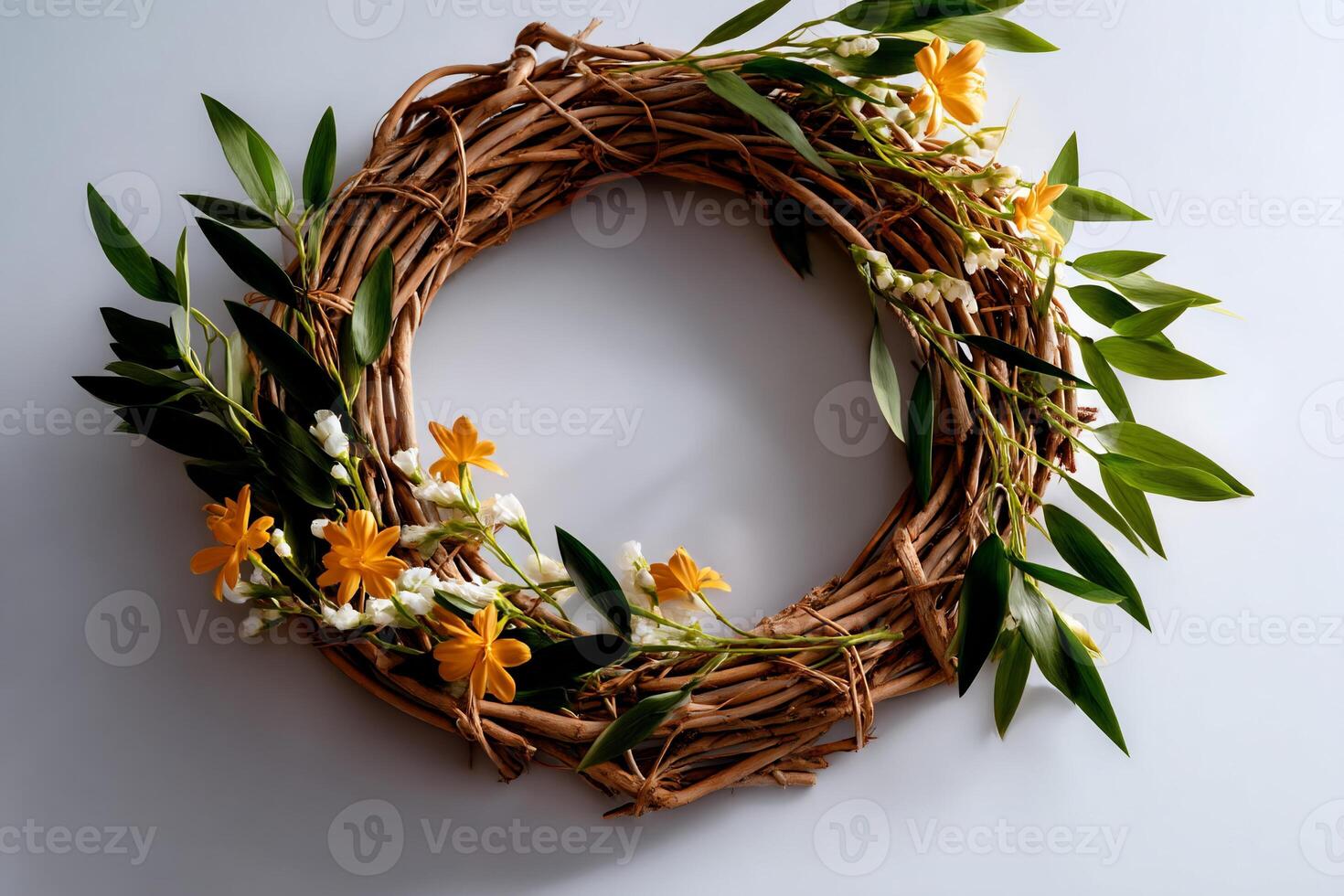 A delicate spring wreath, featuring a light brown woven base, adorned with small yellow and white flowers, and vibrant green leaves photo
