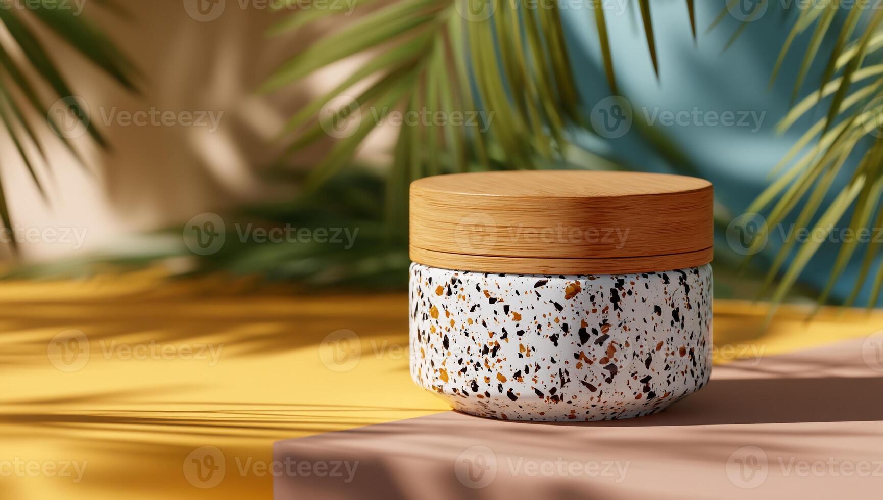 A light beige and wooden cosmetic jar sits on a two-toned backdrop of yellow and blush, with palm fronds casting shadows photo