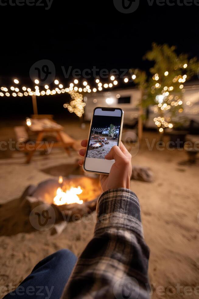 Nighttime camping photo. Smartphone captures campsite dinner photo