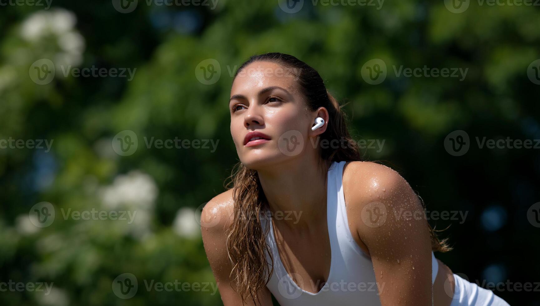 Outdoorsy woman with wireless earbuds photo