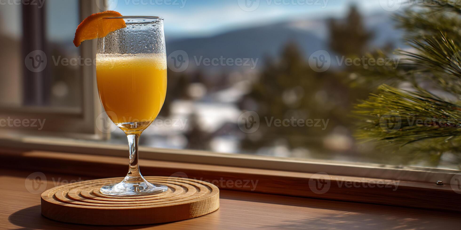 Orange juice cocktail on a windowsill photo