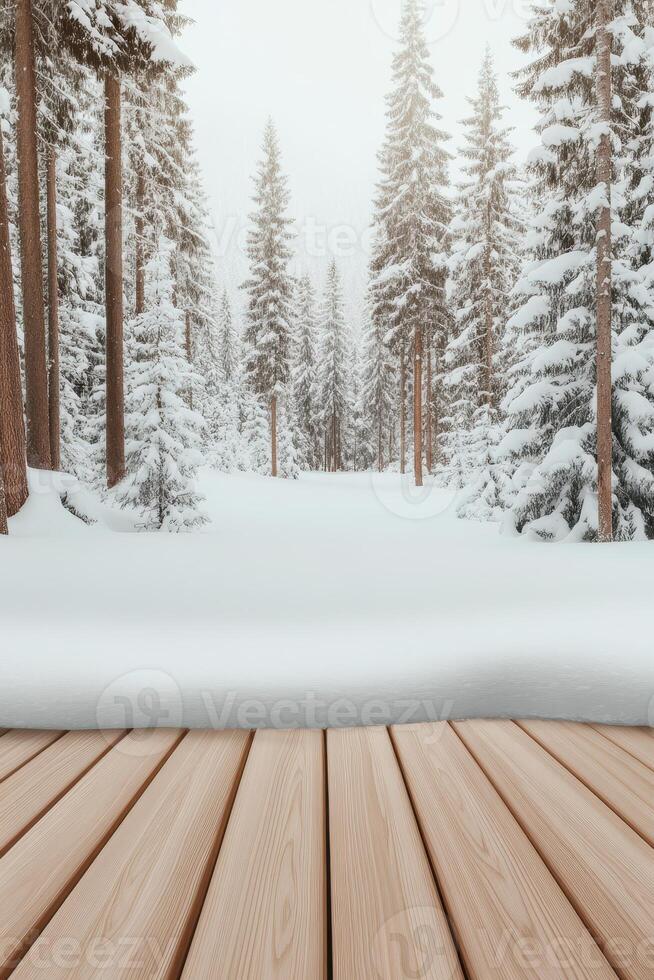 Wooden planks overlook snow covered ground and trees. Forest scene with tall trees coated in snow. Winter scene shows a white landscape. photo