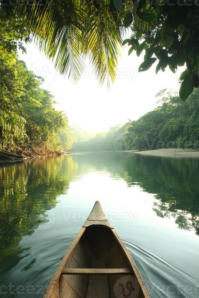 Early morning light casts a peaceful glow over the still waters as a canoe glides through a lush tropical jungle, surrounded by vibrant greenery photo