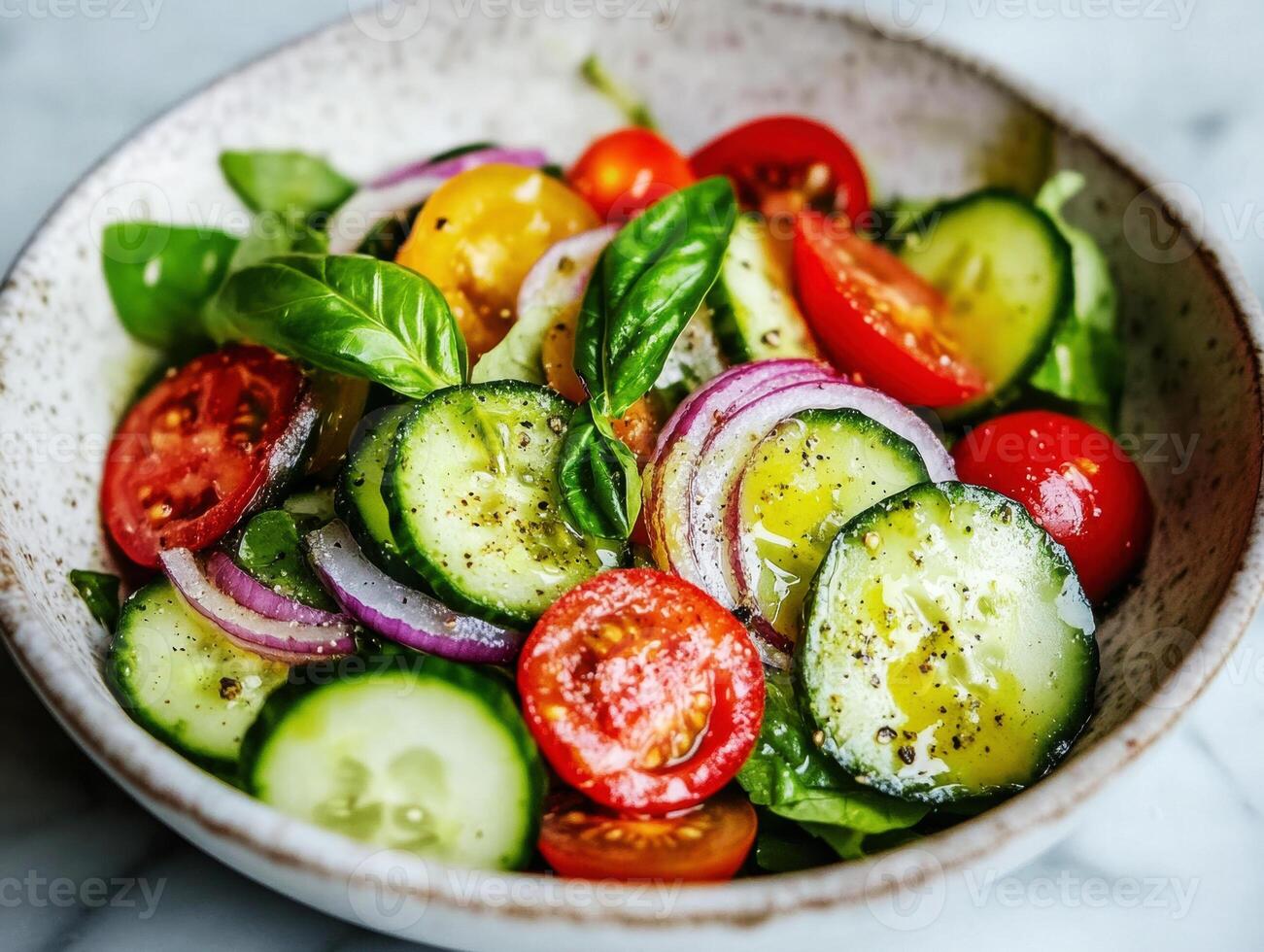 Fresh vegetable salad with basil served in a rustic bowl photo