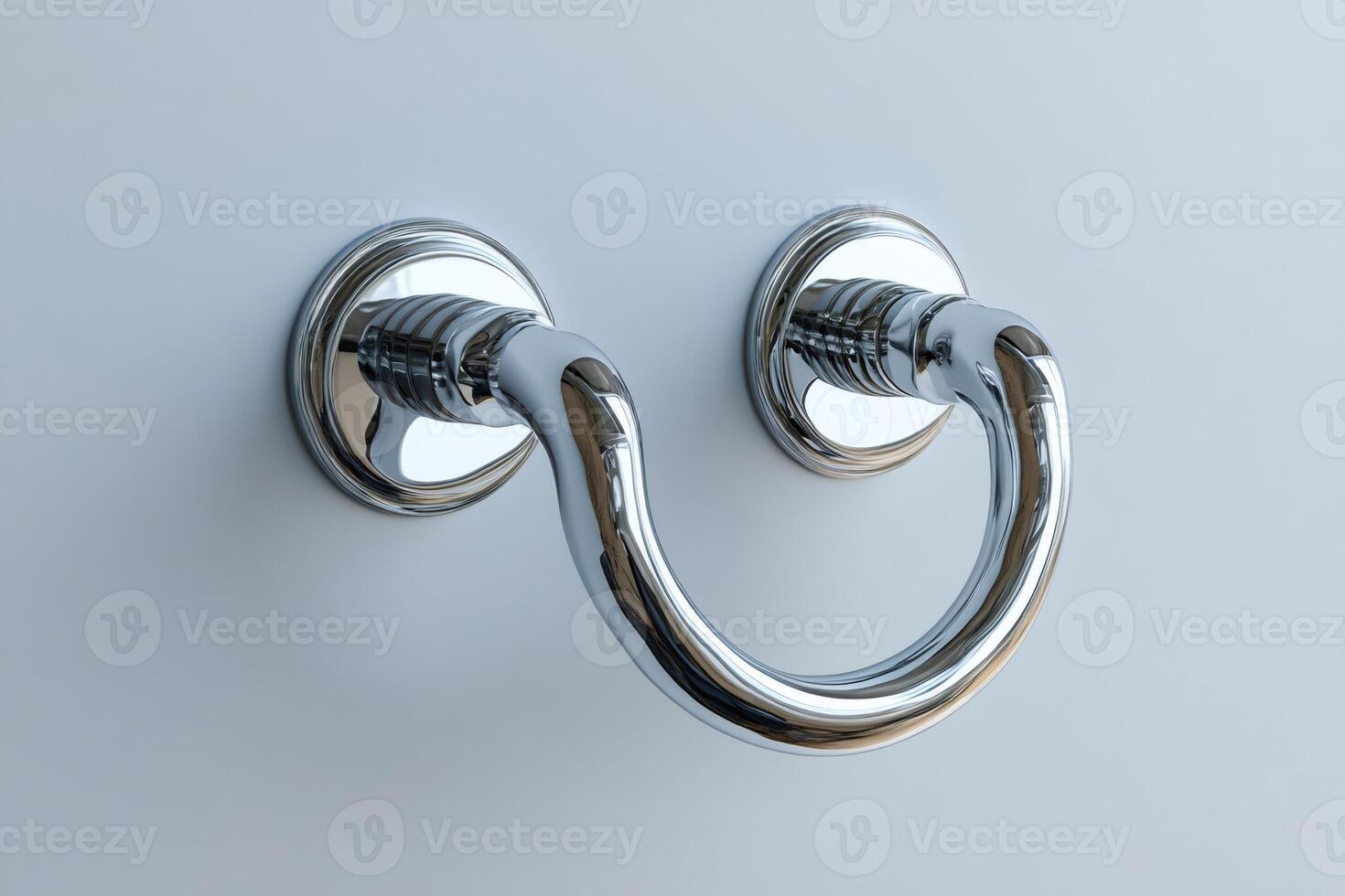 Shiny chrome drawer pull handle reflecting on a white background photo