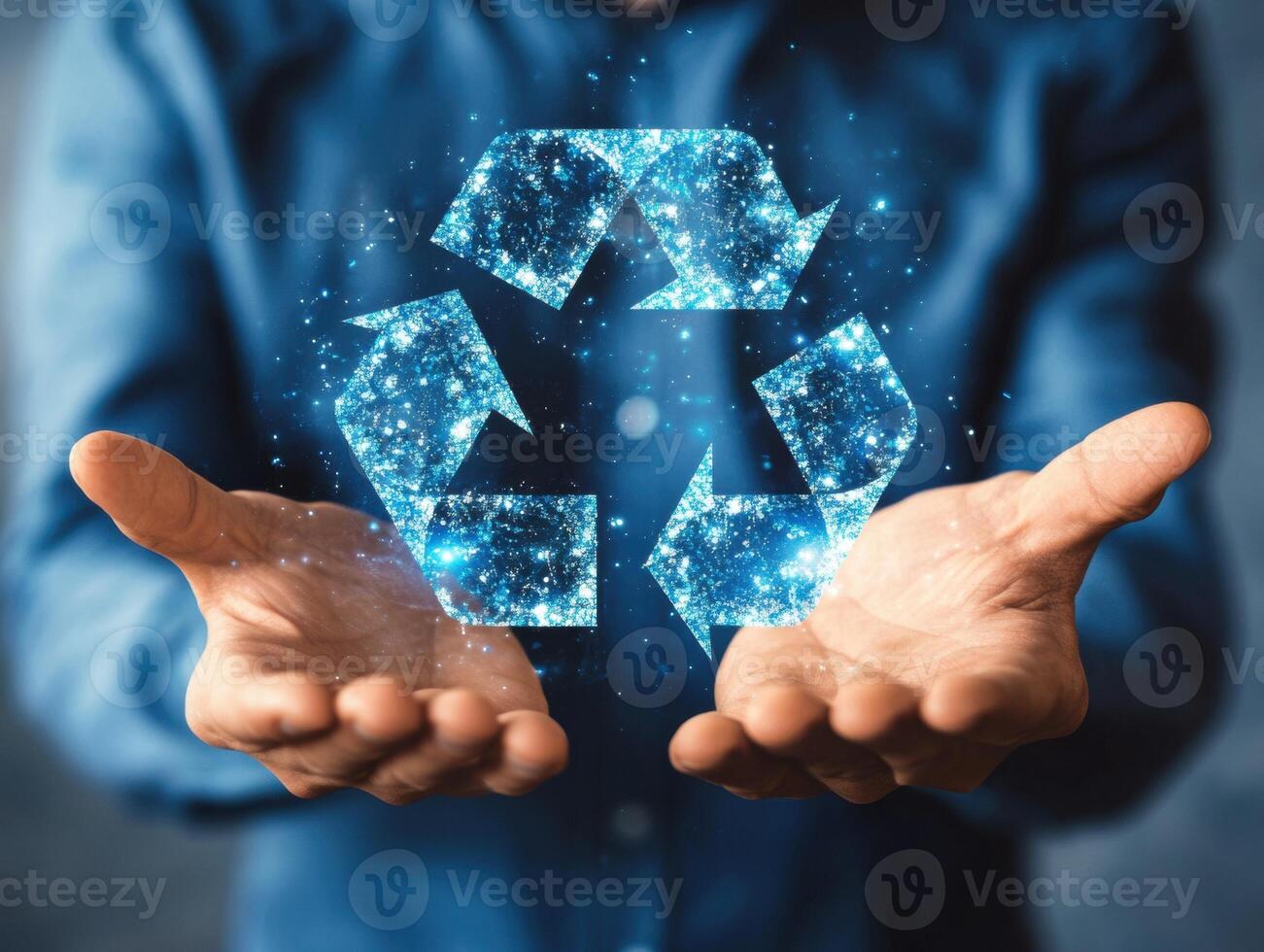 Hands with a glowing recycling symbol for eco-friendly practices photo