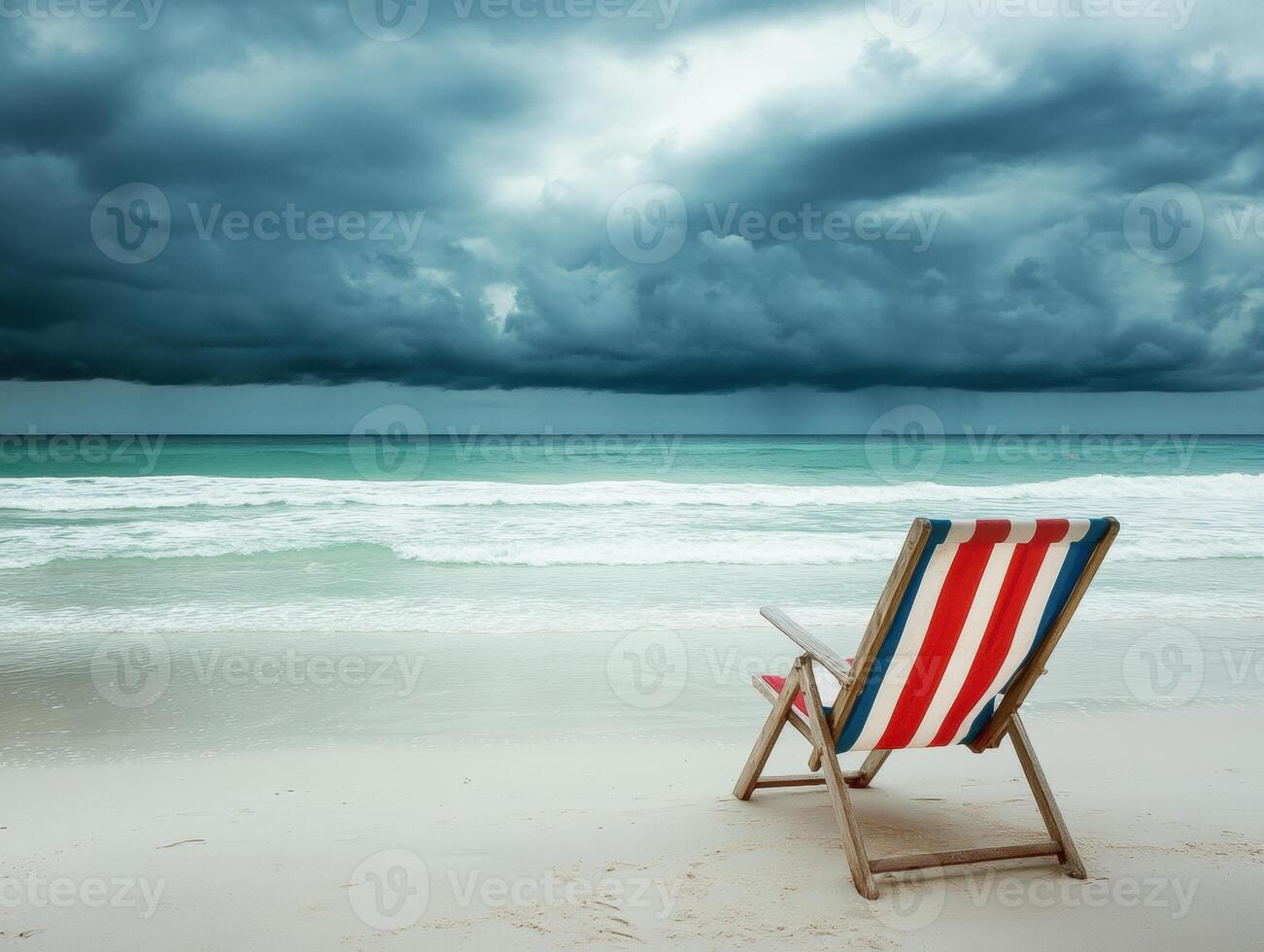 Relaxing at the beach with ominous clouds gathering overhead photo