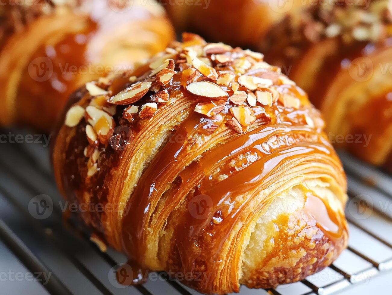 Chocolate croissant topped with nuts in a bakery setting photo