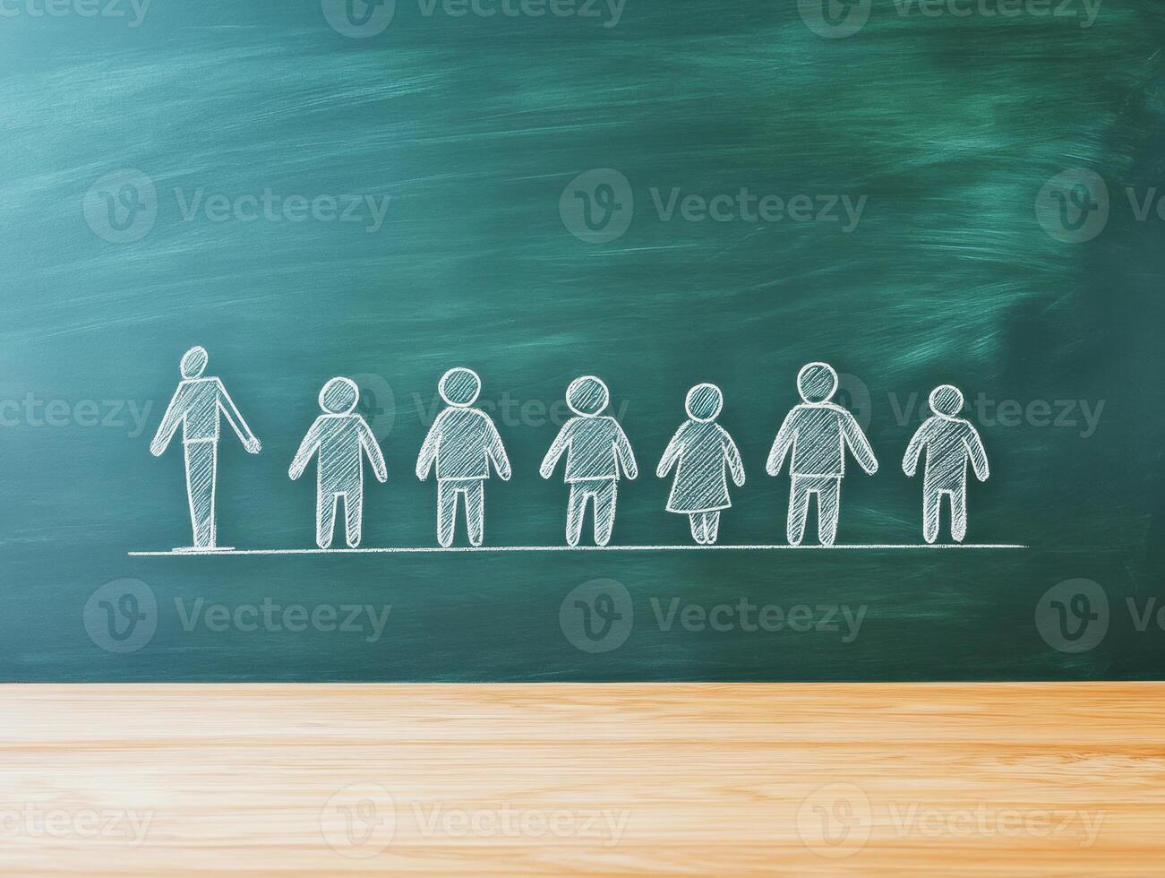 Silhouette of diverse figures on chalkboard in classroom setting photo