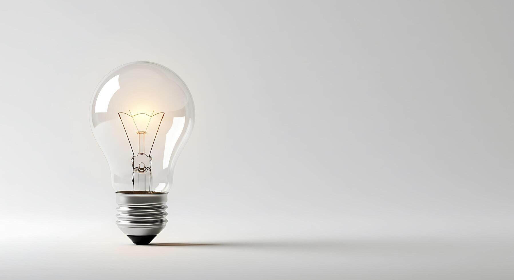 A light bulb is shown in front of a white background photo