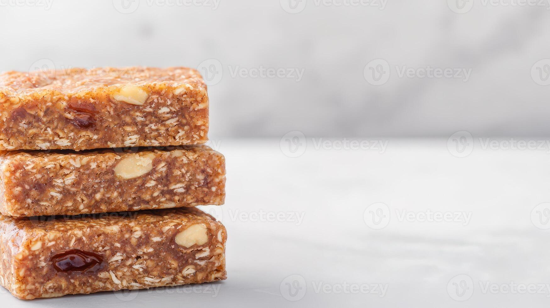 Three delicious homemade granola bars stacked on a light marble surface create a tempting and healthy snack image perfect for food blogs and websites. photo