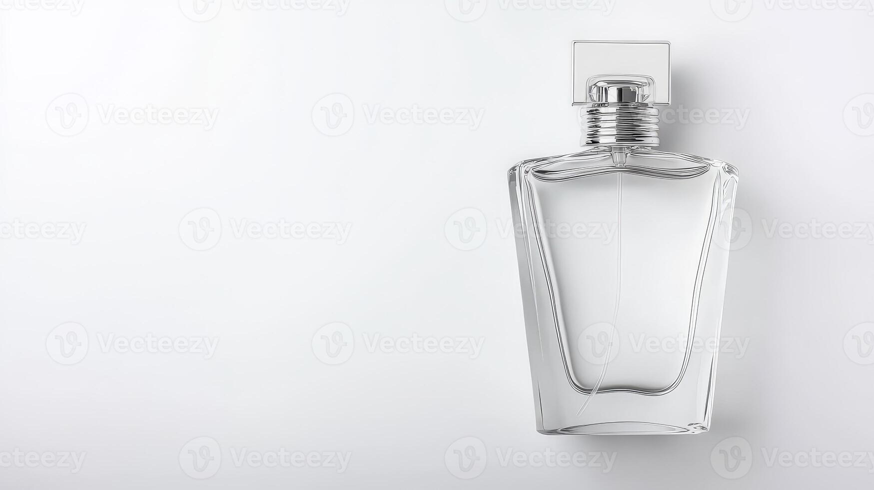 A clear glass perfume bottle on a white background photo